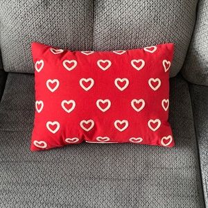 Red pillow with white hearts